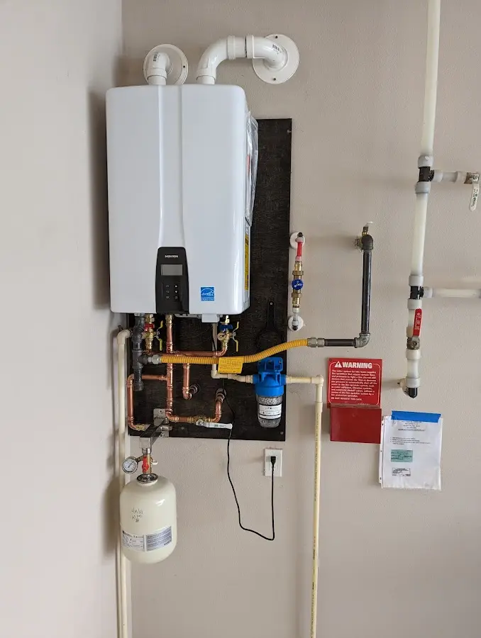 Professional plumber installing copper piping in a Grass Valley home